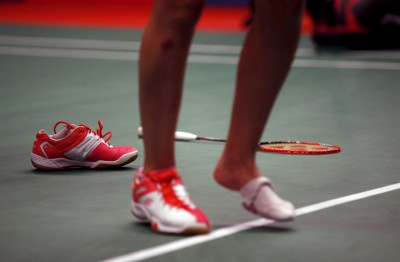 Spain's Carolina Marin walks on the court after receiving treatment for an injured foot during her women's singles badminton match with Taiwan's Pai Yu-po at the BWF World Championship in Jakarta, Indonesia August 13, 2015. REUTERS/Darren Whiteside